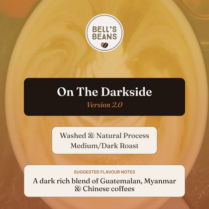 Coffee package labeled 'On The Darkside' by Bell's Beans with coffee bean design.