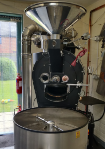 10kg coffee roaster in the corner of bells beans coffee roastery. The doors are open and the sun is shining in.